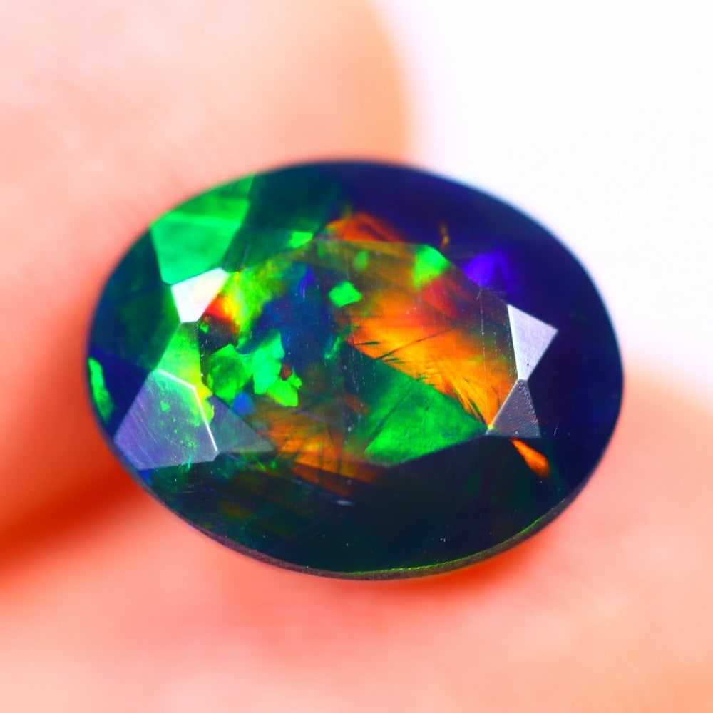2.33Ct Welo Black Opal Polished - Ethiopian Opal - Oval Faceted: Ksmith Jewels Global Welcome to our auction house, today auction brought to you by Ksmith Jewels Global based in Penang, Malaysia specialize in all kinds of opal and color gemstone both in manufacturi