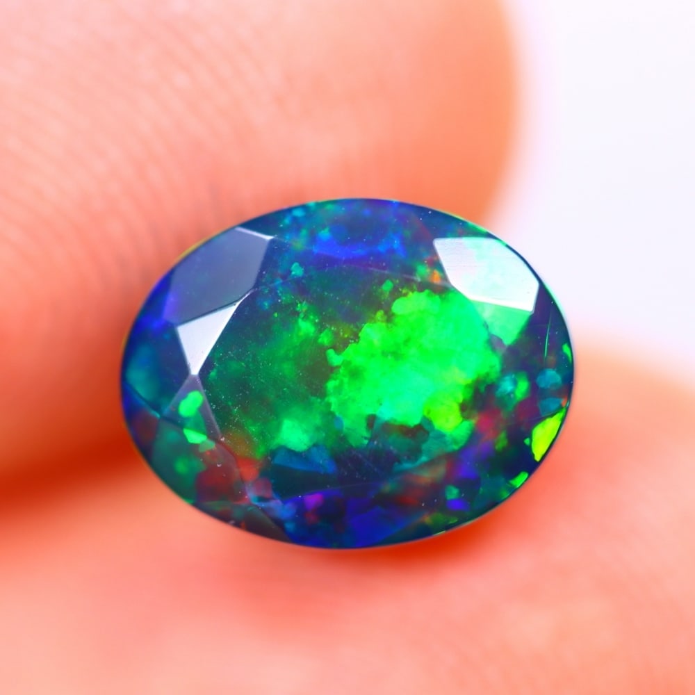 1.62Ct Welo Black Opal Polished - Ethiopian Opal - Oval Faceted: Ksmith Jewels Global Welcome to our auction house, today auction brought to you by Ksmith Jewels Global based in Penang, Malaysia specialize in all kinds of opal and color gemstone both in manufacturi