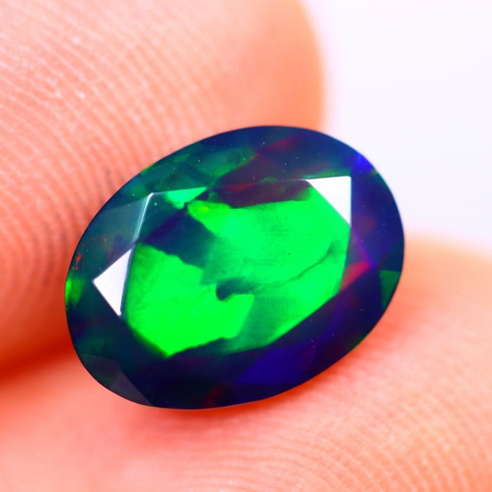 1.43Ct Welo Black Opal Polished - Ethiopian Opal - Oval Faceted: Ksmith Jewels Global Welcome to our auction house, today auction brought to you by Ksmith Jewels Global based in Penang, Malaysia specialize in all kinds of opal and color gemstone both in manufacturi