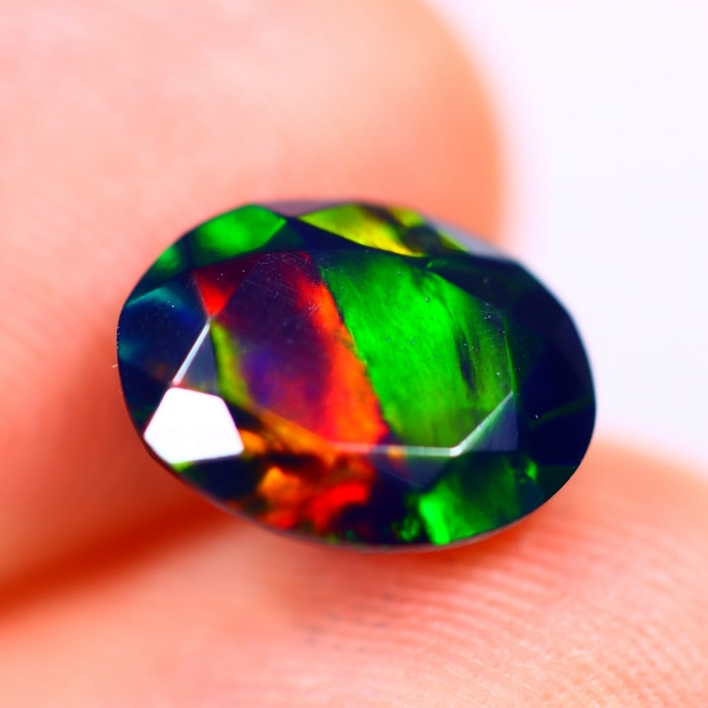 1.57Ct Welo Black Opal Polished - Ethiopian Opal - Oval Faceted: Ksmith Jewels Global Welcome to our auction house, today auction brought to you by Ksmith Jewels Global based in Penang, Malaysia specialize in all kinds of opal and color gemstone both in manufacturi