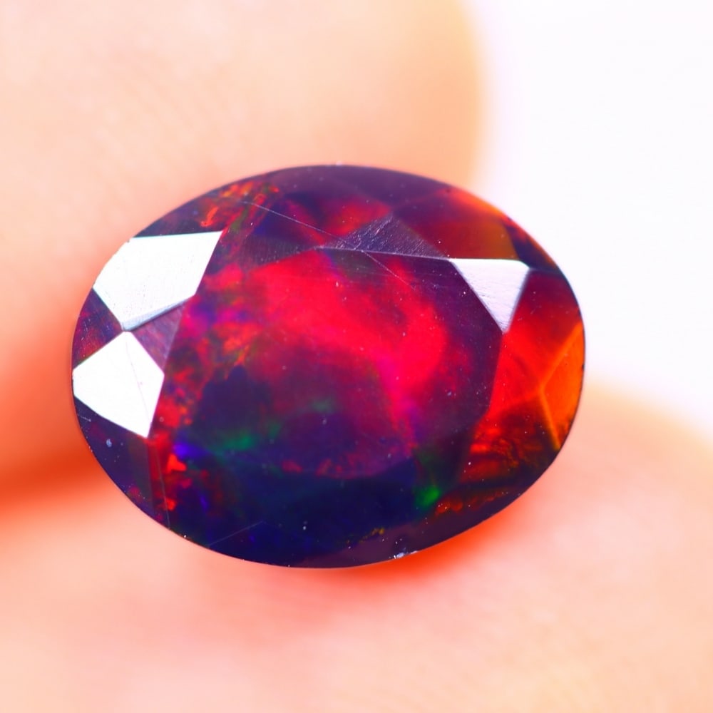 1.90Ct Welo Black Opal Polished - Ethiopian Opal - Oval Faceted: Ksmith Jewels Global Welcome to our auction house, today auction brought to you by Ksmith Jewels Global based in Penang, Malaysia specialize in all kinds of opal and color gemstone both in manufacturi