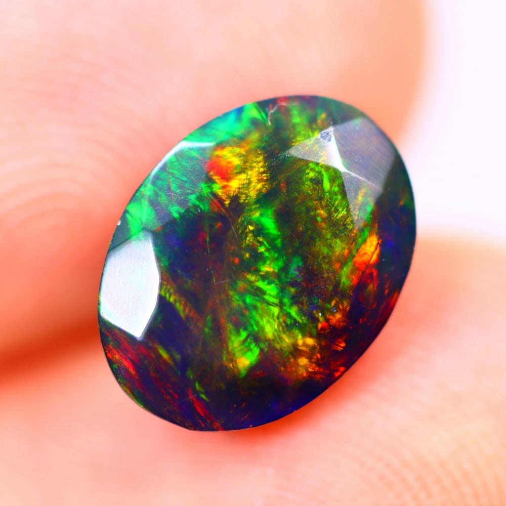 1.69Ct Welo Black Opal Polished - Ethiopian Opal - Oval Faceted: Ksmith Jewels Global Welcome to our auction house, today auction brought to you by Ksmith Jewels Global based in Penang, Malaysia specialize in all kinds of opal and color gemstone both in manufacturi