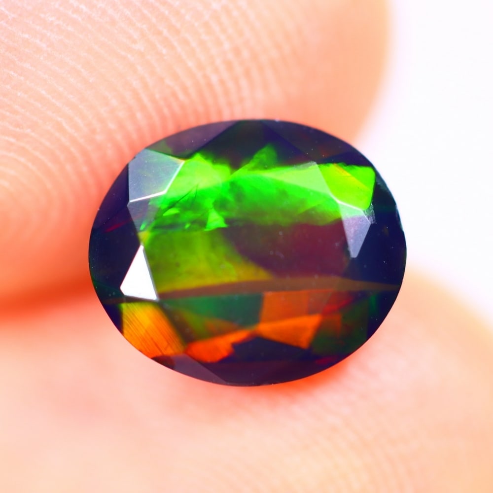 1.37Ct Welo Black Opal Polished - Ethiopian Opal - Oval Faceted: Ksmith Jewels Global Welcome to our auction house, today auction brought to you by Ksmith Jewels Global based in Penang, Malaysia specialize in all kinds of opal and color gemstone both in manufacturi