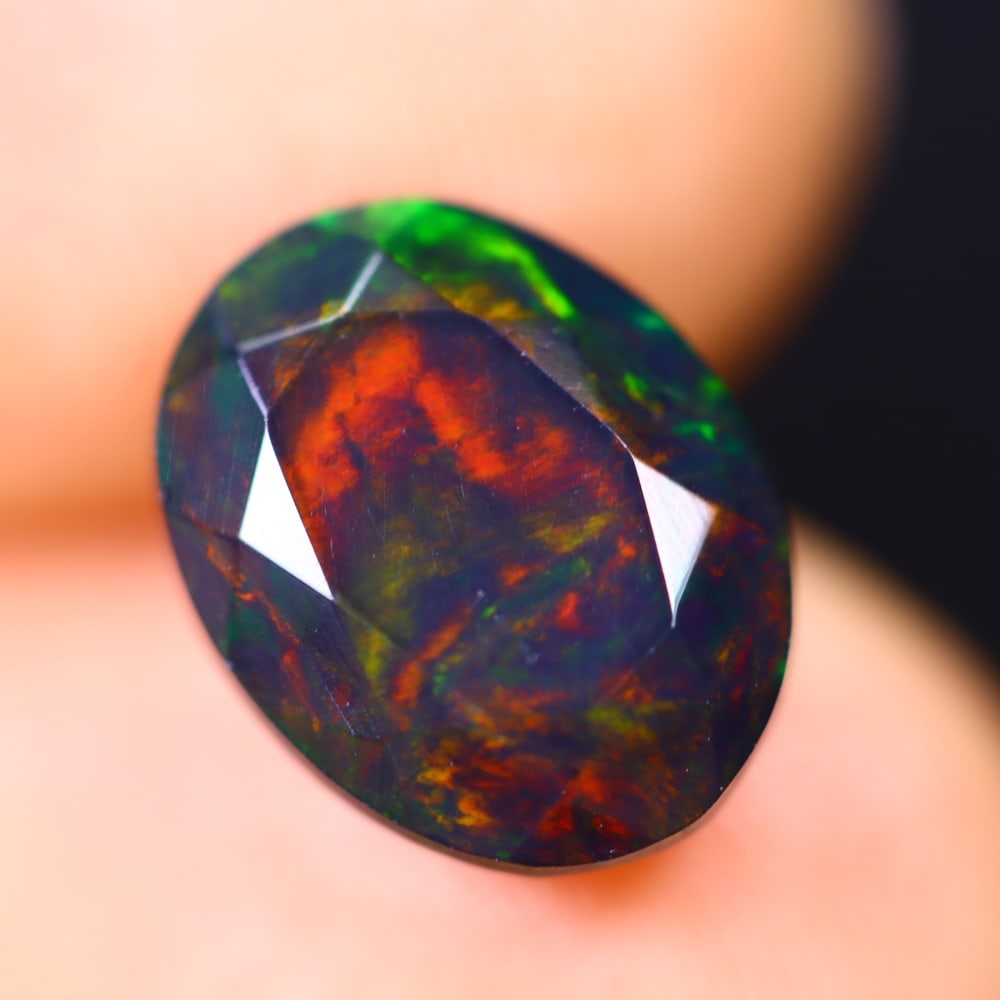 2.04Ct Welo Black Opal Polished - Ethiopian Opal - Oval Faceted: Ksmith Jewels Global Welcome to our auction house, today auction brought to you by Ksmith Jewels Global based in Penang, Malaysia specialize in all kinds of opal and color gemstone both in manufacturi