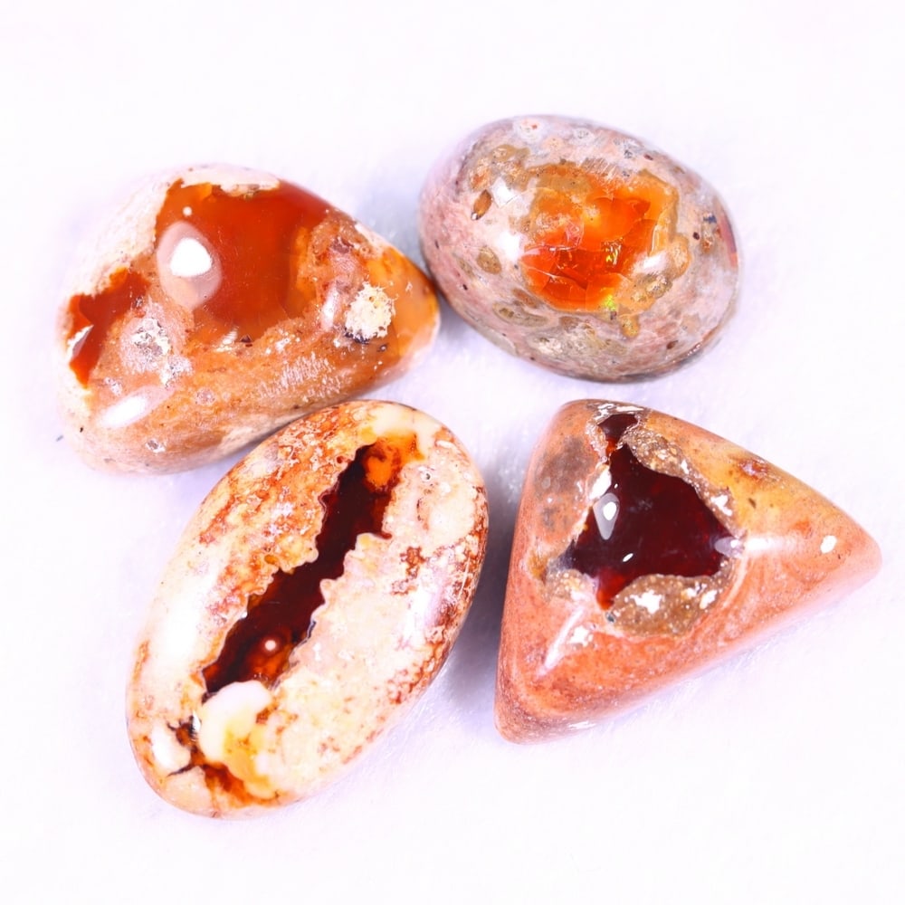 34.64Ct Group of 4 Mexican Fire Opal - Mexican Opal - Cabochon: Ksmith Jewels Global Welcome to our auction house, today auction brought to you by Ksmith Jewels Global based in Penang, Malaysia specialize in all kinds of opal and color gemstone both in manufacturi