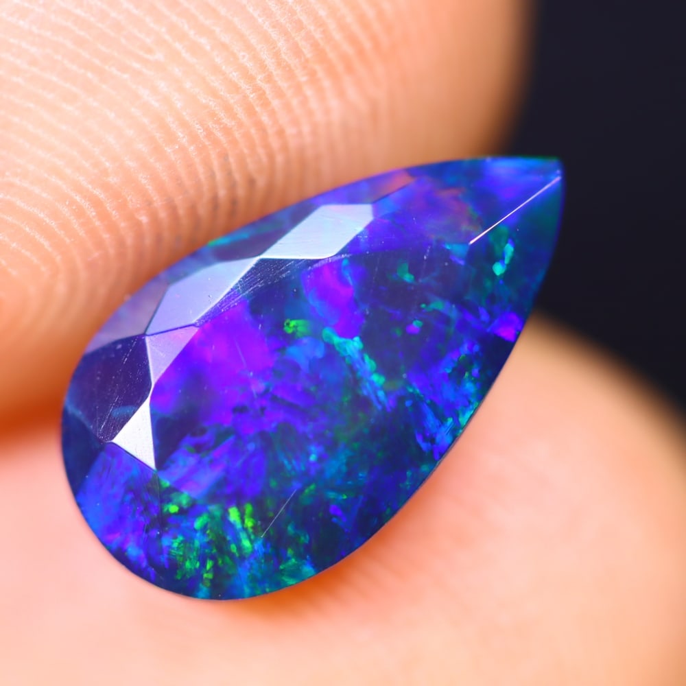 1.70Ct Welo Black Opal Polished - Ethiopian Opal - Pear Faceted: Ksmith Jewels Global Welcome to our auction house, today auction brought to you by Ksmith Jewels Global based in Penang, Malaysia specialize in all kinds of opal and color gemstone both in manufacturi