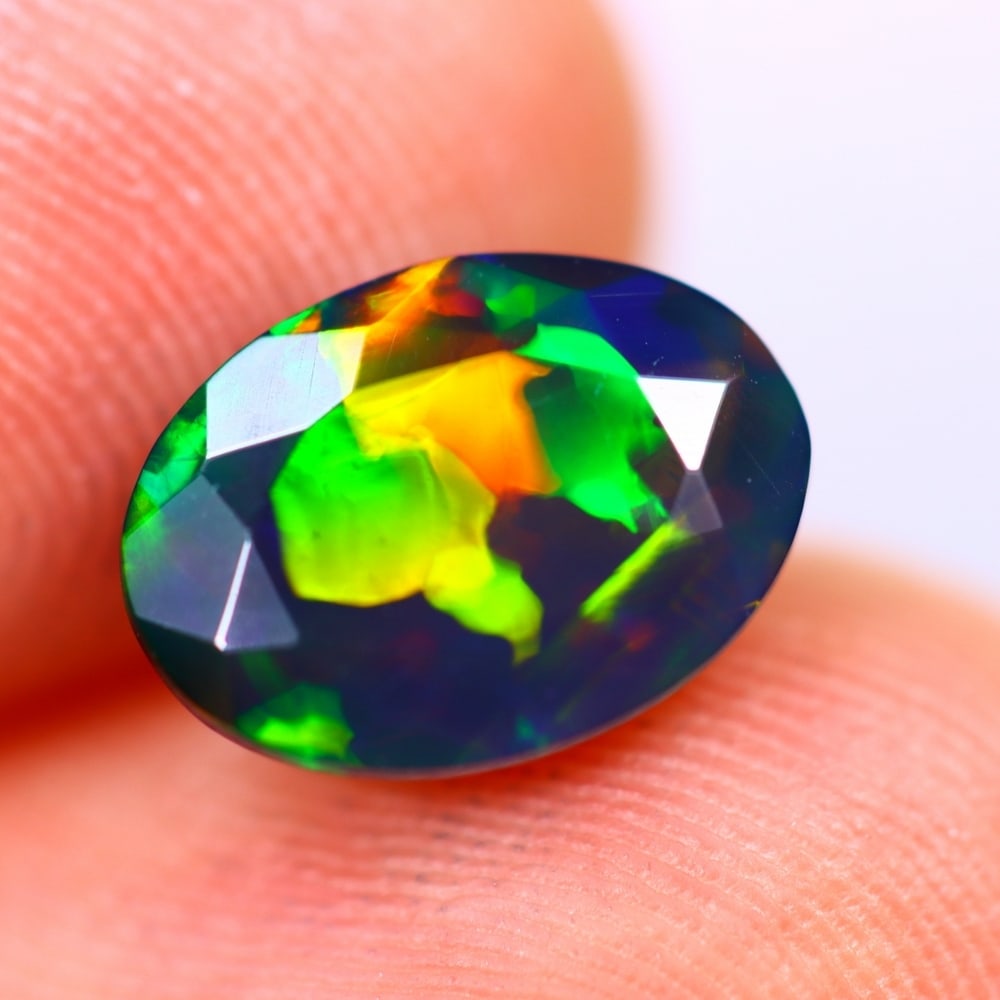 1.43Ct Welo Black Opal Polished - Ethiopian Opal - Oval Faceted: Ksmith Jewels Global Welcome to our auction house, today auction brought to you by Ksmith Jewels Global based in Penang, Malaysia specialize in all kinds of opal and color gemstone both in manufacturi
