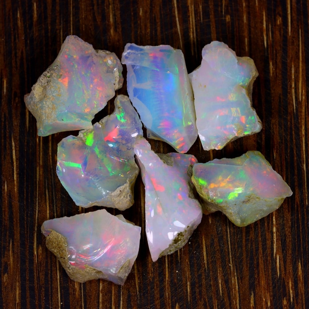 39Ct Group of 7 Rough Opal Specimen - Ethiopian Opal - Mineral Rough Set: Ksmith Jewels Global Welcome to our auction house, today auction brought to you by Ksmith Jewels Global based in Penang, Malaysia specialize in all kinds of opal and color gemstone both in manufacturi
