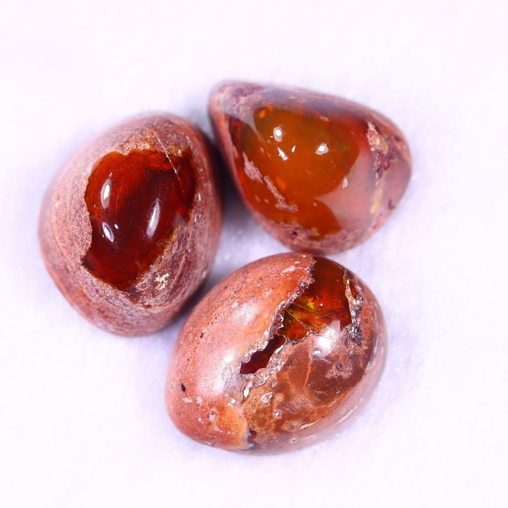 25.81Ct Group of 3 Mexican Fire Opal - Mexican Opal - Cabochon: Ksmith Jewels Global Welcome to our auction house, today auction brought to you by Ksmith Jewels Global based in Penang, Malaysia specialize in all kinds of opal and color gemstone both in manufacturi