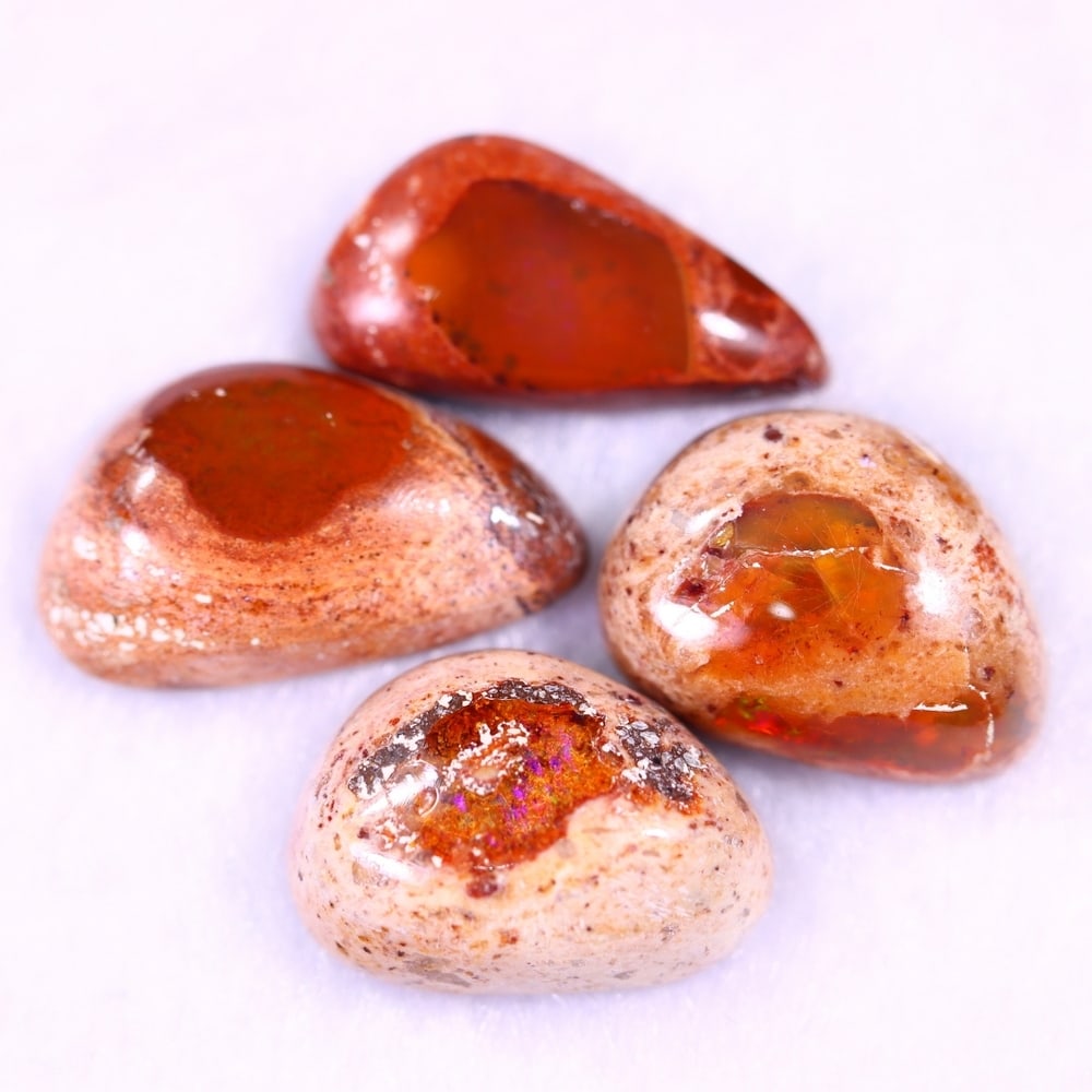 23.63Ct Group of 4 Mexican Fire Opal - Mexican Opal - Cabochon: Ksmith Jewels Global Welcome to our auction house, today auction brought to you by Ksmith Jewels Global based in Penang, Malaysia specialize in all kinds of opal and color gemstone both in manufacturi