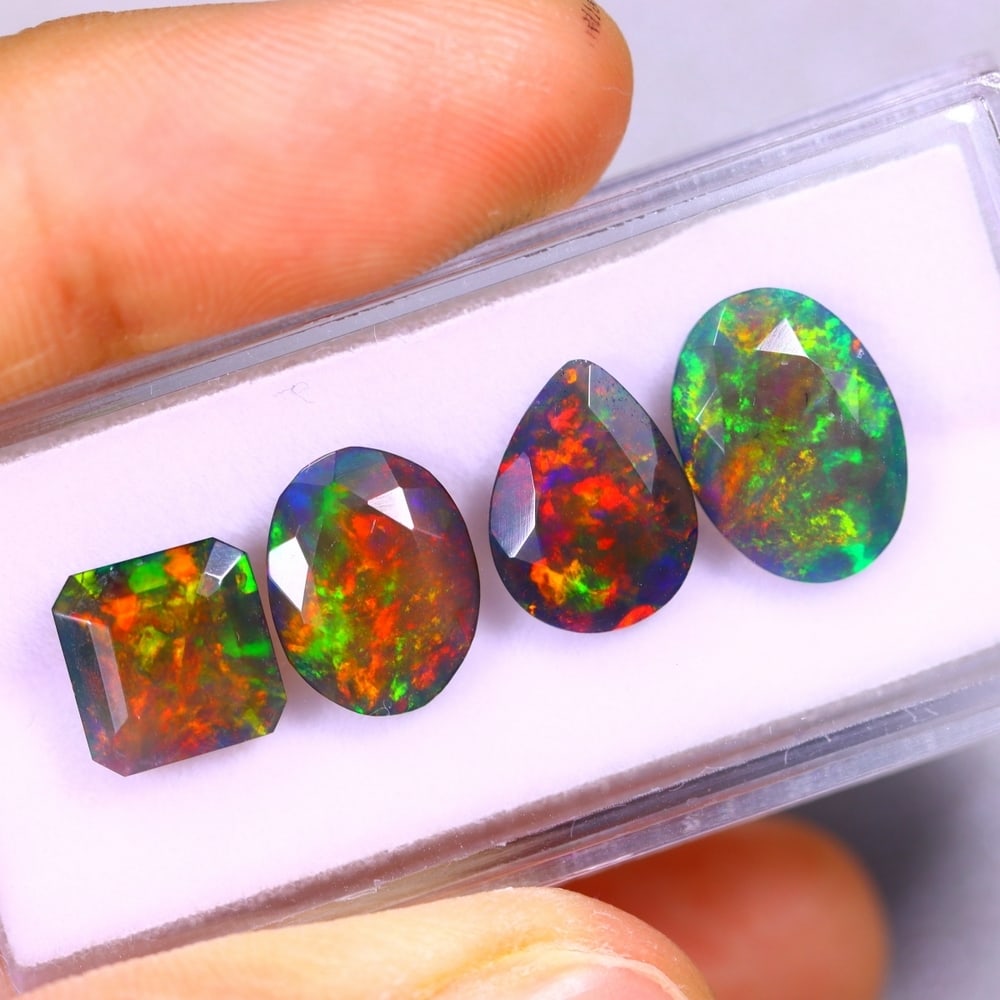 7.30Ct Group of 4 Welo Black Opal Polished - Ethiopian Opal - Faceted Set: Ksmith Jewels Global Welcome to our auction house, today auction brought to you by Ksmith Jewels Global based in Penang, Malaysia specialize in all kinds of opal and color gemstone both in manufacturi