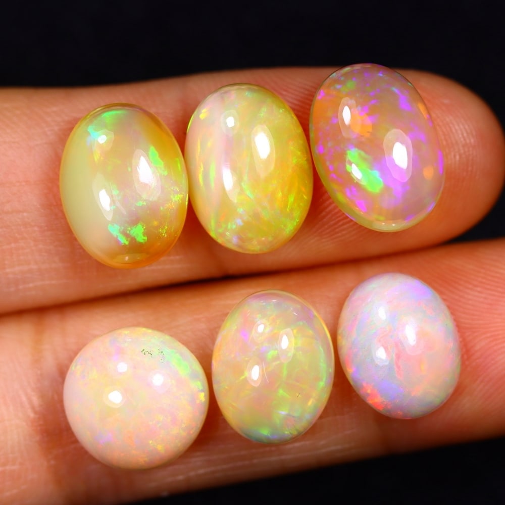 18Ct Group of 6 Welo Opal Polished - Ethiopian Opal: Ksmith Jewels Global Welcome to our auction house, today auction brought to you by Ksmith Jewels Global based in Penang, Malaysia specialize in all kinds of opal and color gemstone both in manufacturi