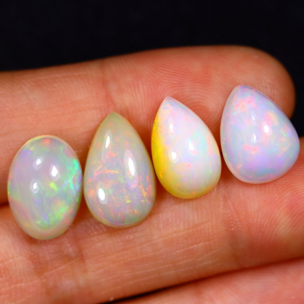 13.86Ct Group of 4 Welo Opal Polished - Ethiopian Opal: Ksmith Jewels Global Welcome to our auction house, today auction brought to you by Ksmith Jewels Global based in Penang, Malaysia specialize in all kinds of opal and color gemstone both in manufacturi