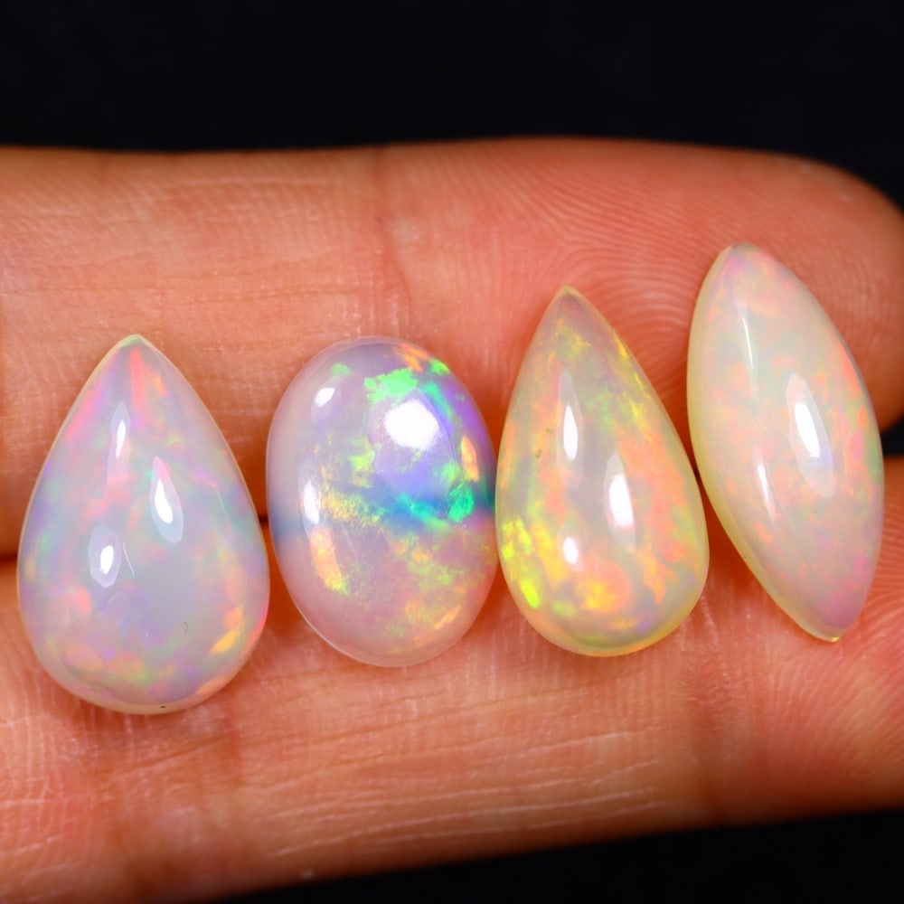 13.94Ct Group of 4 Welo Opal Polished - Ethiopian Opal: Ksmith Jewels Global Welcome to our auction house, today auction brought to you by Ksmith Jewels Global based in Penang, Malaysia specialize in all kinds of opal and color gemstone both in manufacturi