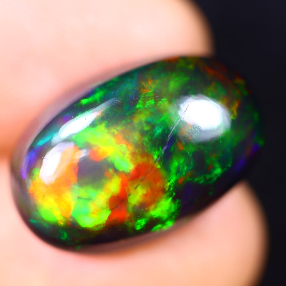 10.73Ct Welo Black Opal Polished - Ethiopian Opal - Oval Cabochon: Ksmith Jewels Global Welcome to our auction house, today auction brought to you by Ksmith Jewels Global based in Penang, Malaysia specialize in all kinds of opal and color gemstone both in manufacturi