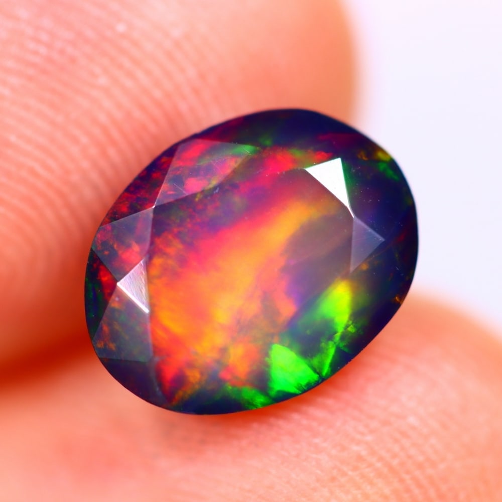 1.76Ct Welo Black Opal Polished - Ethiopian Opal - Oval Faceted: Ksmith Jewels Global Welcome to our auction house, today auction brought to you by Ksmith Jewels Global based in Penang, Malaysia specialize in all kinds of opal and color gemstone both in manufacturi