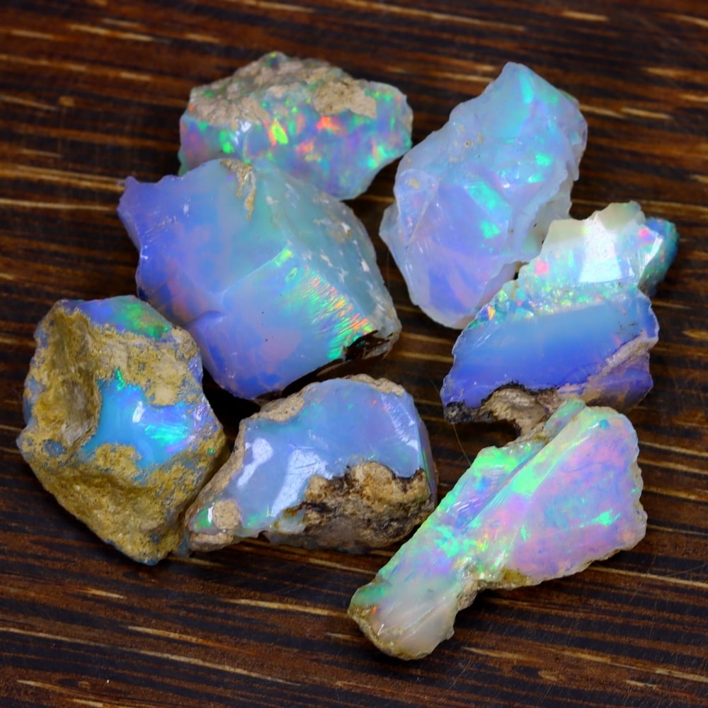 62Ct Group of 7 Rough Opal Specimen - Ethiopian Opal - Mineral Rough Set: Ksmith Jewels Global Welcome to our auction house, today auction brought to you by Ksmith Jewels Global based in Penang, Malaysia specialize in all kinds of opal and color gemstone both in manufacturi
