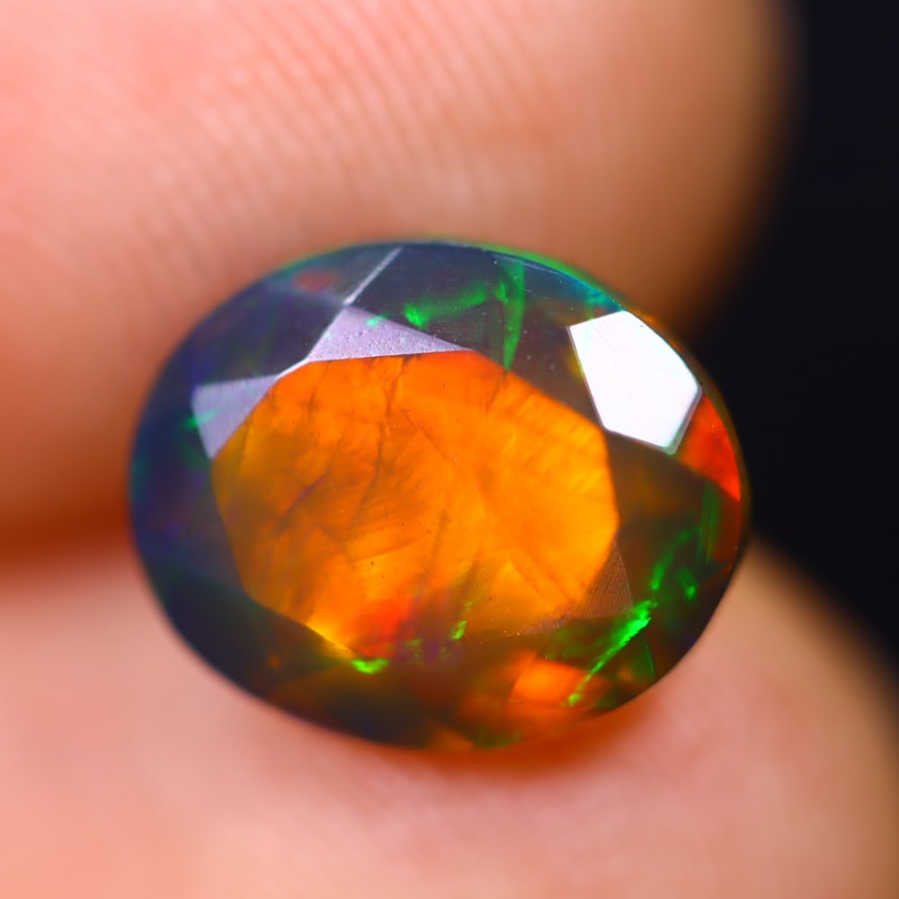 1.83Ct Welo Black Opal Polished - Ethiopian Opal - Oval Faceted: Ksmith Jewels Global Welcome to our auction house, today auction brought to you by Ksmith Jewels Global based in Penang, Malaysia specialize in all kinds of opal and color gemstone both in manufacturi