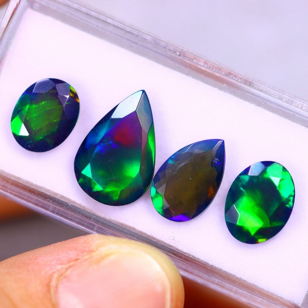 7.07Ct Group of 4 Welo Black Opal Polished - Ethiopian Opal - Faceted Set: Ksmith Jewels Global Welcome to our auction house, today auction brought to you by Ksmith Jewels Global based in Penang, Malaysia specialize in all kinds of opal and color gemstone both in manufacturi