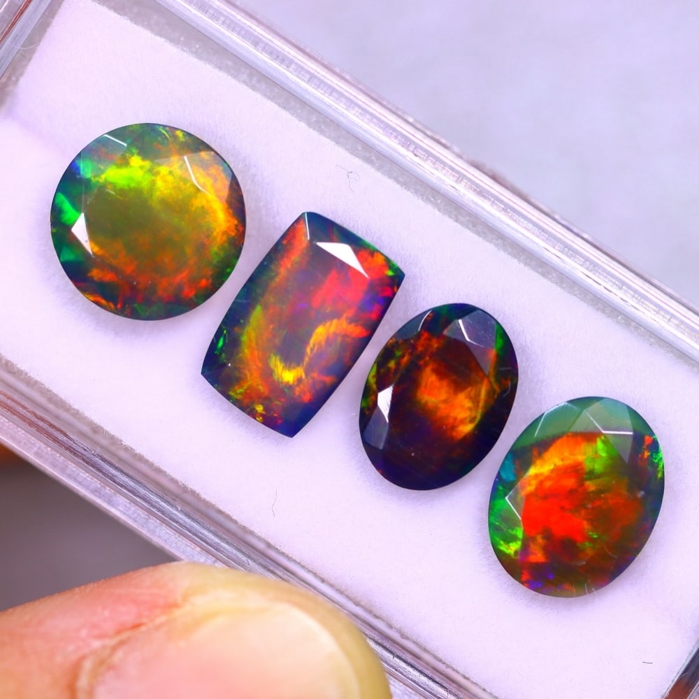 7.19Ct Group of 4 Welo Black Opal Polished - Ethiopian Opal - Faceted Set: Ksmith Jewels Global Welcome to our auction house, today auction brought to you by Ksmith Jewels Global based in Penang, Malaysia specialize in all kinds of opal and color gemstone both in manufacturi