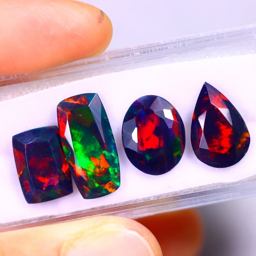 9.37Ct Group of 4 Welo Black Opal Polished - Ethiopian Opal - Faceted Set: Ksmith Jewels Global Welcome to our auction house, today auction brought to you by Ksmith Jewels Global based in Penang, Malaysia specialize in all kinds of opal and color gemstone both in manufacturi
