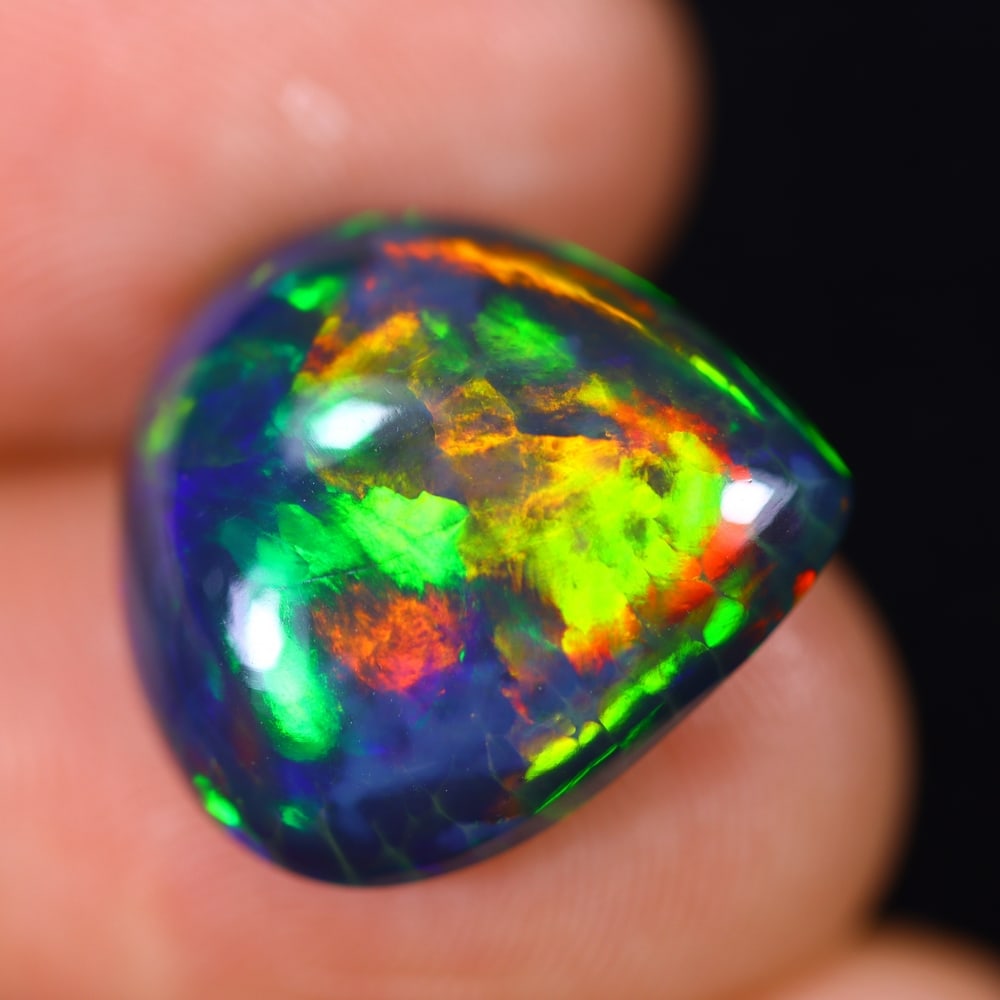 7.01Ct Welo Black Opal Polished - Ethiopian Opal - Pear Cabochon: Ksmith Jewels Global Welcome to our auction house, today auction brought to you by Ksmith Jewels Global based in Penang, Malaysia specialize in all kinds of opal and color gemstone both in manufacturi