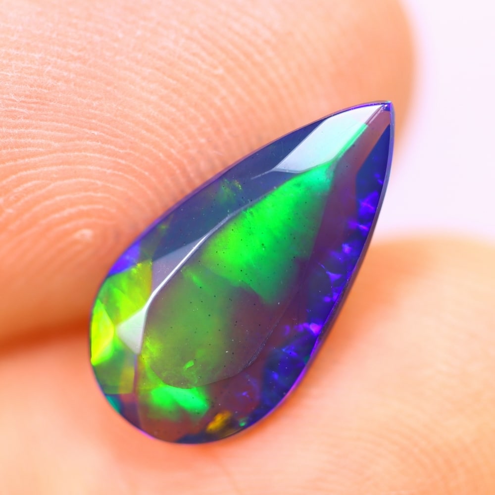 1.58Ct Welo Black Opal Polished - Ethiopian Opal - Pear Faceted: Ksmith Jewels Global Welcome to our auction house, today auction brought to you by Ksmith Jewels Global based in Penang, Malaysia specialize in all kinds of opal and color gemstone both in manufacturi