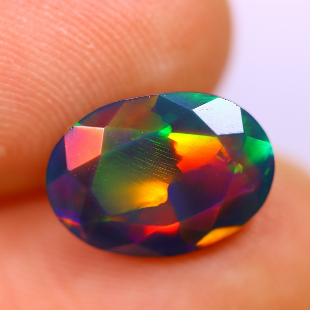 2.24Ct Welo Black Opal Polished - Ethiopian Opal - Oval Faceted: Ksmith Jewels Global Welcome to our auction house, today auction brought to you by Ksmith Jewels Global based in Penang, Malaysia specialize in all kinds of opal and color gemstone both in manufacturi