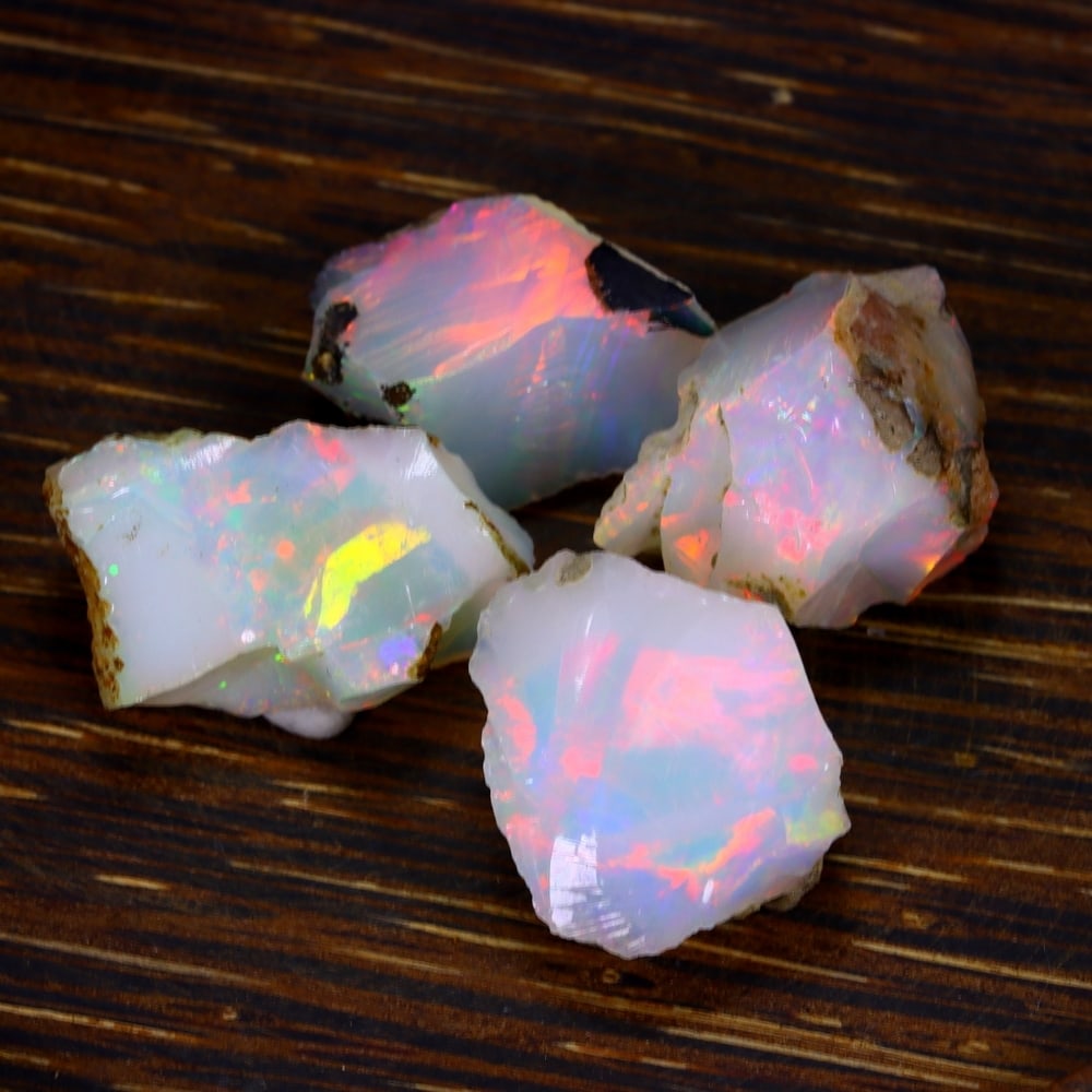 49Ct Group of 4 Rough Opal Specimen - Ethiopian Opal - Mineral Rough Set: Ksmith Jewels Global Welcome to our auction house, today auction brought to you by Ksmith Jewels Global based in Penang, Malaysia specialize in all kinds of opal and color gemstone both in manufacturi