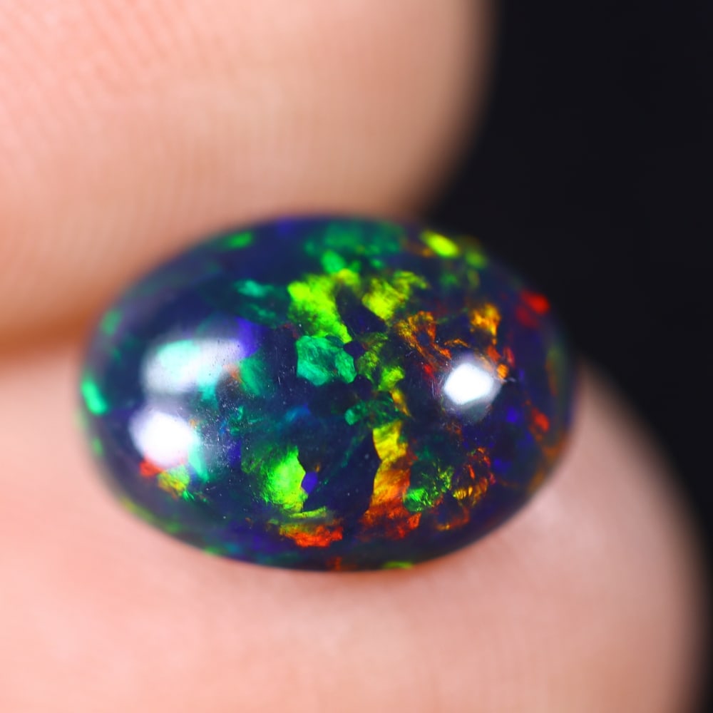 1.27Ct Welo Black Opal Polished - Ethiopian Opal - Oval Cabochon: Ksmith Jewels Global Welcome to our auction house, today auction brought to you by Ksmith Jewels Global based in Penang, Malaysia specialize in all kinds of opal and color gemstone both in manufacturi
