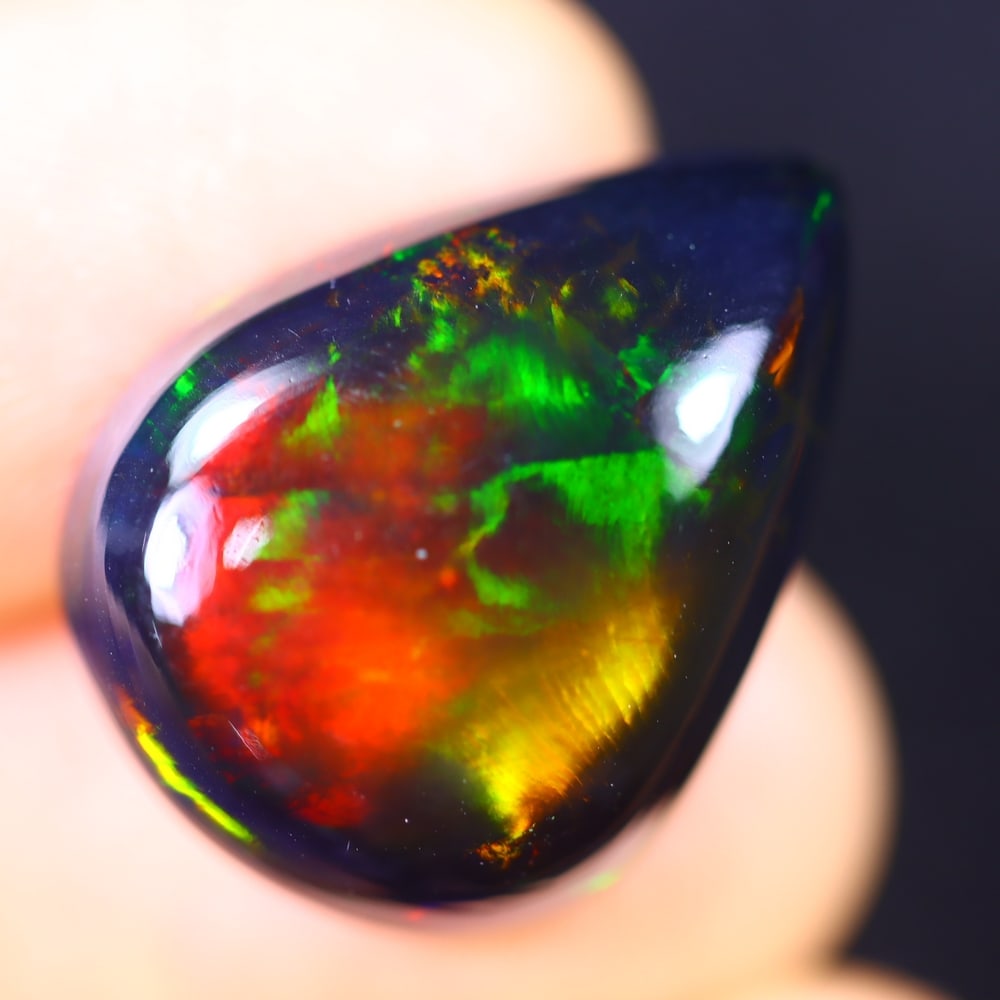 10.72Ct Welo Black Opal Polished - Ethiopian Opal - Pear Cabochon: Ksmith Jewels Global Welcome to our auction house, today auction brought to you by Ksmith Jewels Global based in Penang, Malaysia specialize in all kinds of opal and color gemstone both in manufacturi