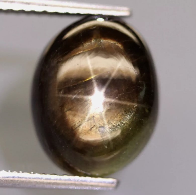 Star Sapphire 6.92Ct Natural Greenish 6 Rays Gold Star Sapphire: Ksmith Jewels Global Welcome to our auction house, today auction brought to you by Ksmith Jewels Global based in Penang, Malaysia specialize in all kinds of opal and color gemstone both in manufacturi