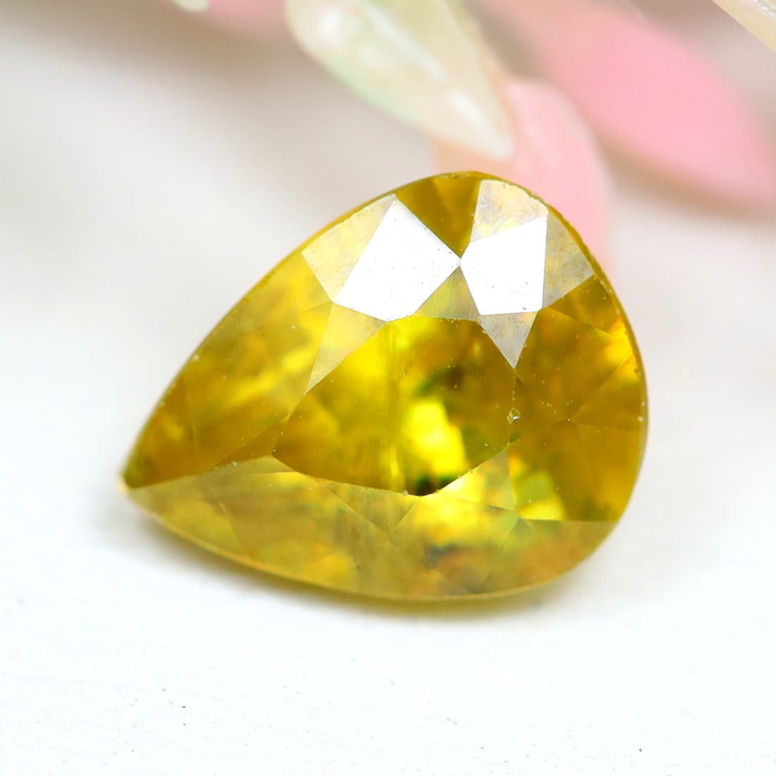 Sphene 1.47Ct Natural Pear Cut Unheated Yellowish Green Sphene: Ksmith Jewels Global Welcome to our auction house, today auction brought to you by Ksmith Jewels Global based in Penang, Malaysia specialize in all kinds of opal and color gemstone both in manufacturi