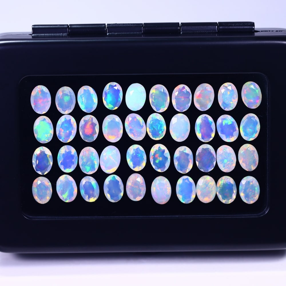 *19.15Ct Calibrated 7x5mm Faceted Welo Opal Set - Ethiopian Opal, 174B: Ksmith Heritage Auctioneers Welcome to our auction house, today auction brought to you by Ksmith Heritage Auctioneers based in Penang, Malaysia specialize in all kinds of opal and color gemstone both