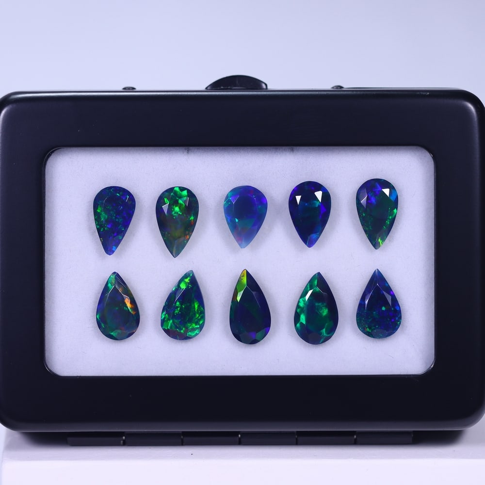 *12.23Ct 10pcs Faceted Smoked Welo Opal Set - Ethiopian Opal , 115E: Ksmith Heritage Auctioneers Subject: Natural Ethiopian Black Welo Opal Origin: Ethiopia Carat Weight: 12.23Ct Dimension: 11x7x3 mm Treatment: Heated Type: Faceted, Polishe