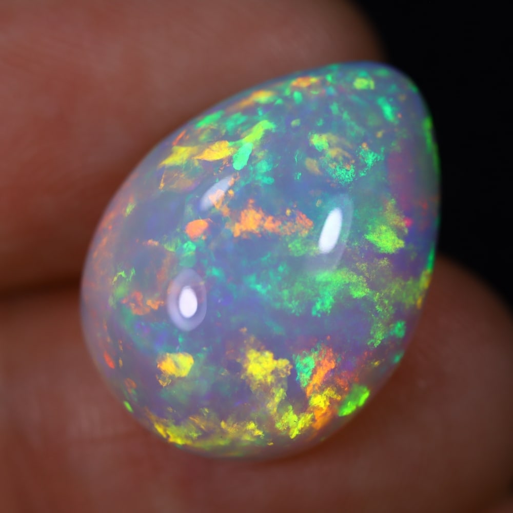 *11.03Ct Welo Opal Polished - Ethiopian Opal , 117E: Ksmith Heritage Auctioneers Subject: Natural Ethiopian Welo Opal Origin: Ethiopia Carat Weight: 11.03Ct Dimension: 19.2x14.4x8 mm Treatment: Natural Untreated Type: Caboch