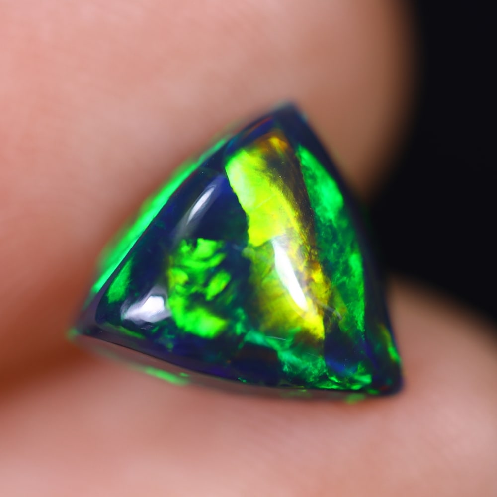 1.93Ct Welo Black Opal Polished - Ethiopian Opal , 243E: Ksmith Heritage Auctioneers Subject: Natural Ethiopian Welo Black Opal Origin: Ethiopia Carat Weight: 1.93Ct Dimension: 9.7x9.5x5 mm Treatment: Smoked Type: Cabochon, Poli