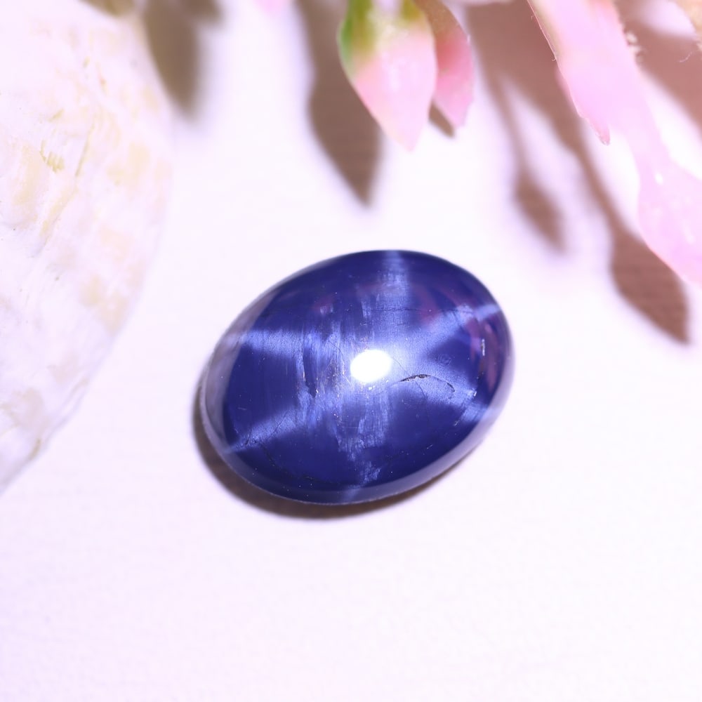 2.44Ct 6 Rays Blue Star Sapphire - Polished Cabochon , 975E: Ksmith Heritage Auctioneers Subject: Natural 6 Rays Star Sapphire Origin: Myanmar Carat Weight: 2.44Ct Dimension: 9.2x6.9x3.5 mm Treatment: Diffusion Type: Cabochon, Polis