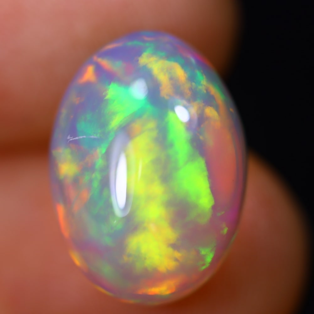 *5.59Ct Welo Opal Polished - Ethiopian Opal - Oval Cabochon, 382B: Ksmith Heritage Auctioneers Subject: Natural Ethiopian Welo Opal Origin: Ethiopia Carat Weight: 5.59Ct Dimension: 15.1 x 10.9 x 6.5 mm Treatment: Natural Untreated Shape: Oval