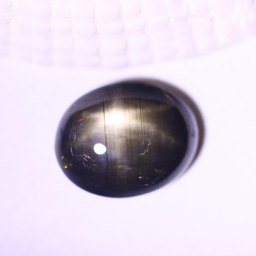 3.78cts 6 Rays Black Star Sapphire , 1068E: Ksmith Heritage Auctioneers Subject: Natural 6 Rays Star Sapphire Origin: Myanmar Carat Weight: 3.78cts Dimension: 9.8x7.9x4.4 mm Treatment: Diffusion Type: Cabochon, Poli