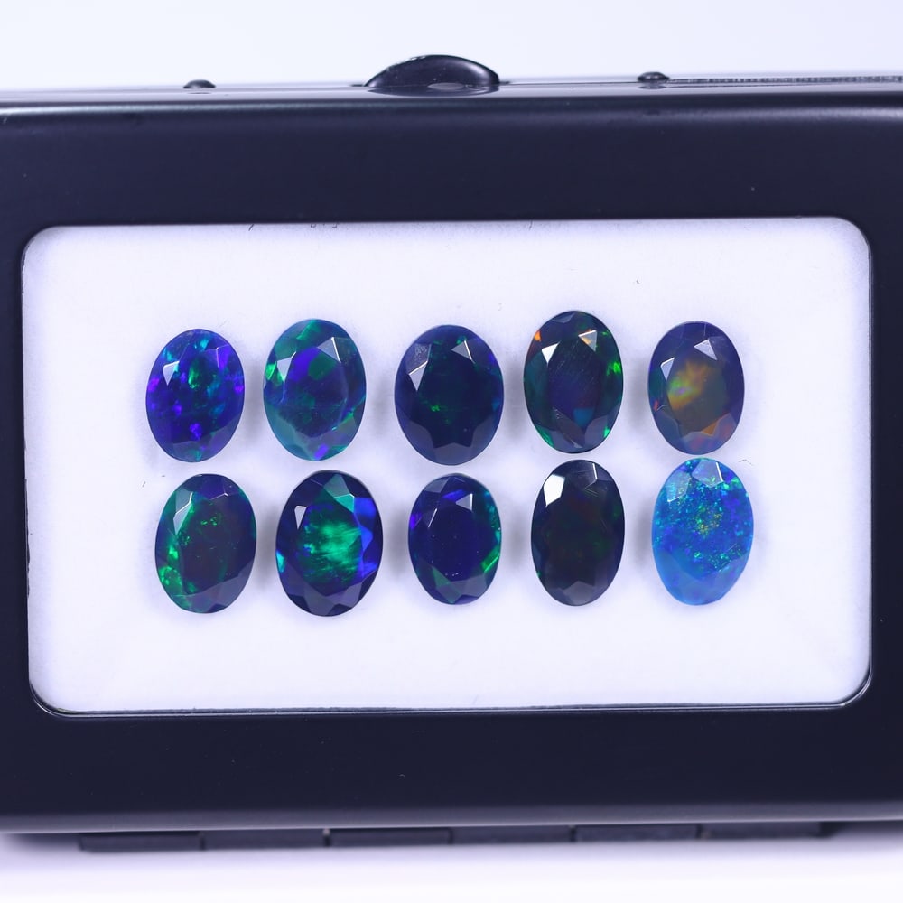*15.12Ct 10pcs Faceted Smoked Welo Opal Set - Ethiopian Opal , 1145E: Ksmith Heritage Auctioneers Subject: Natural Ethiopian Black Welo Opal Origin: Ethiopia Carat Weight: 15.12Ct Dimension: 11x7x4 mm Treatment: Heated Type: Faceted, Polished