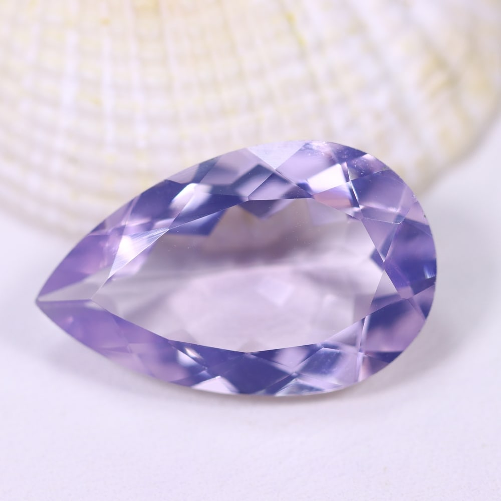14.07Ct Lavender Amethyst - Polished Faceted , 934E: Ksmith Heritage Auctioneers Subject: Natural Lavender Amethyst Origin: Brazil Carat Weight: 14.07Ct Dimension: 22.8x14.4x7.7 mm Treatment: Untreated Type: Faceted, Polished