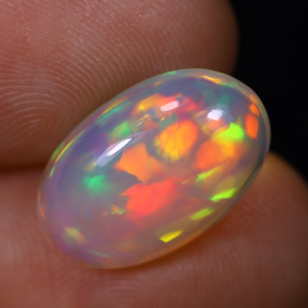 4.81Ct Welo Opal Polished - Ethiopian Opal, 115B: Ksmith Heritage Auctioneers Subject: Natural Ethiopian Welo Opal Origin: Ethiopia Carat Weight: 4.81Ct Dimension: 11.2x10.3x5.5 mm Treatment: Natural Untreated Type: Cabochon,