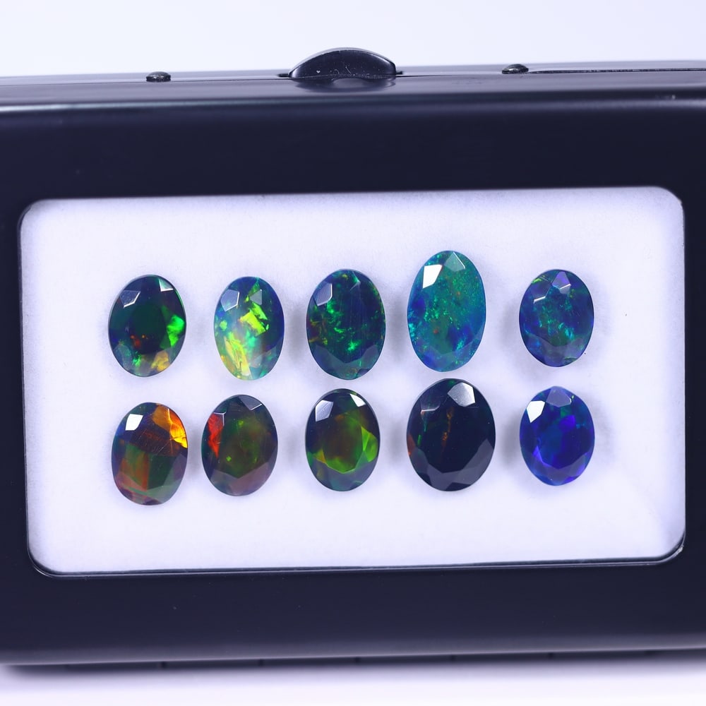 *14.50Ct 10pcs Faceted Smoked Welo Opal Set - Ethiopian Opal , 1113E: Ksmith Heritage Auctioneers Subject: Natural Ethiopian Black Welo Opal Origin: Ethiopia Carat Weight: 14.50Ct Dimension: 10x7x3 mm Treatment: Heated Type: Faceted, Polishe