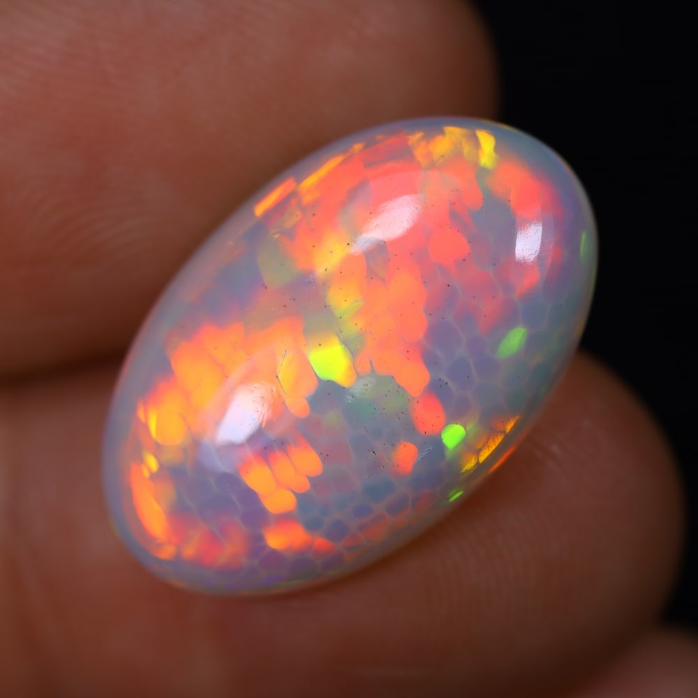 *7.83Ct Welo Opal Polished - Ethiopian Opal, 209B: Ksmith Heritage Auctioneers Subject: Natural Ethiopian Welo Opal Origin: Ethiopia Carat Weight: 7.83Ct Dimension: 20.3x13x5.8 mm Treatment: Natural Untreated Type: Cabochon, Po