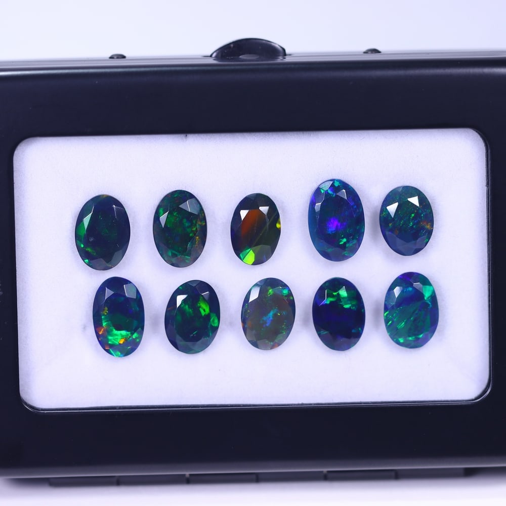 *12.95Ct 10pcs Faceted Smoked Welo Opal Set - Ethiopian Opal, 73B: Ksmith Heritage Auctioneers Subject: Natural Ethiopian Black Welo Opal Origin: Ethiopia Carat Weight: 13.95Ct Dimension: 10x7x4 mm Treatment: Heated Type: Faceted, Polished