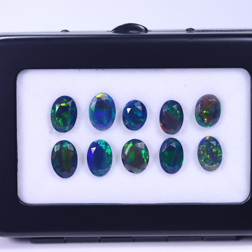 *11.09Ct 10pcs Faceted Smoked Welo Opal Set - Ethiopian Opal, 202B: Ksmith Heritage Auctioneers Subject: Natural Ethiopian Black Welo Opal Origin: Ethiopia Carat Weight: 11.09Ct Dimension: 9x7x3 mm Treatment: Heated Type: Faceted, Polished <