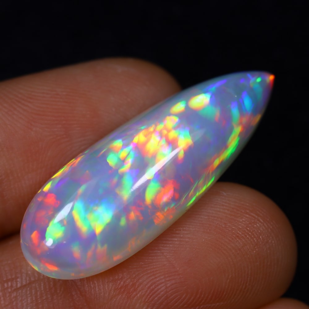 *12.46Ct Welo Opal Polished - Ethiopian Opal , 1028E: Ksmith Heritage Auctioneers Subject: Natural Ethiopian Welo Opal Origin: Ethiopia Carat Weight: 12.46Ct Dimension: 32.4x11.6x7.1 mm Treatment: Natural Untreated Type: Cabo