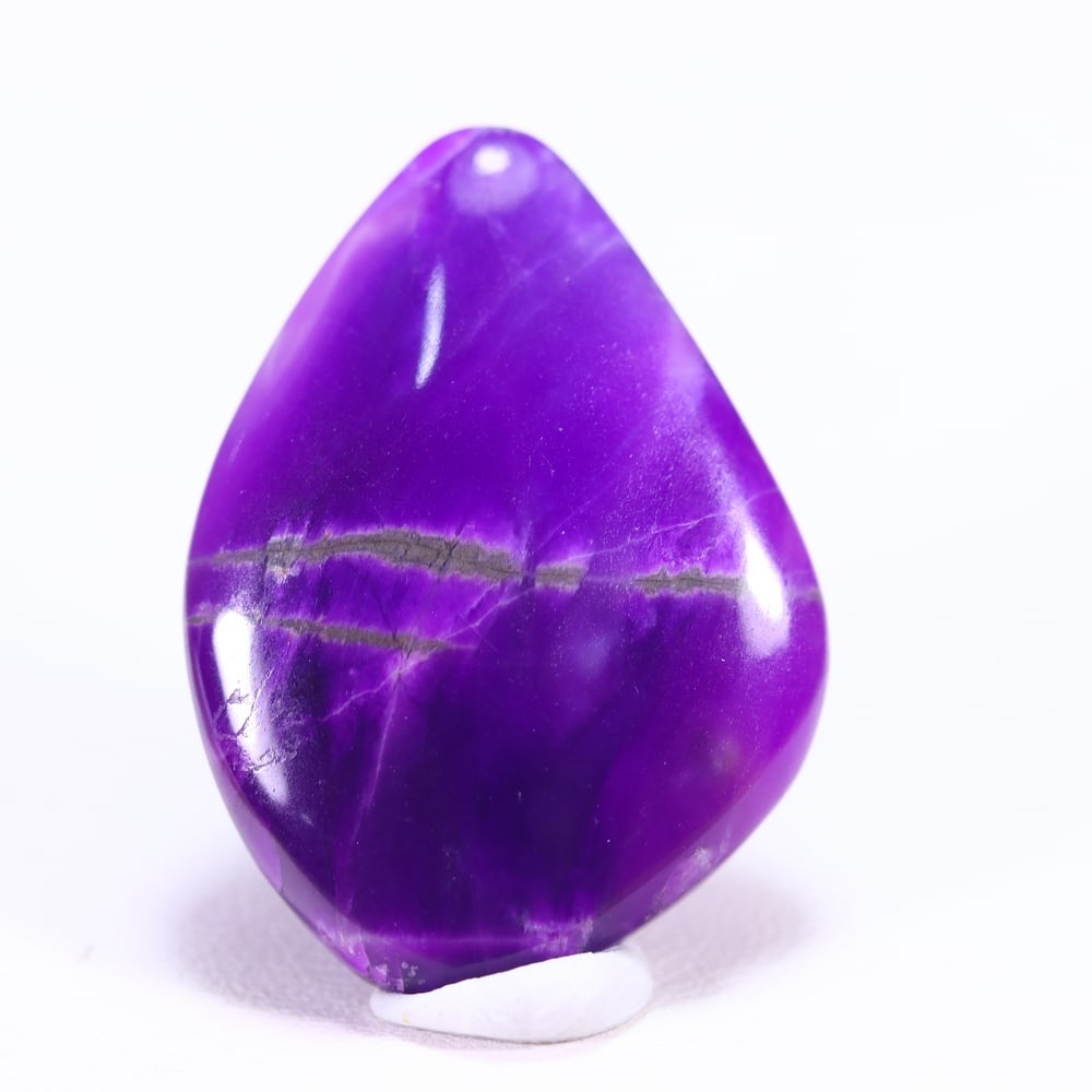 18.66cts Natural Rare Purple Sugilite Cabochon - No treated , 984E: Ksmith Heritage Auctioneers Subject: Natural Sugilite Origin: South Africa Carat Weight: 18.66Ct Dimension: 26.3x19.3x4.8 mm Treatment: No Treatment Type: Cabochon, Polish