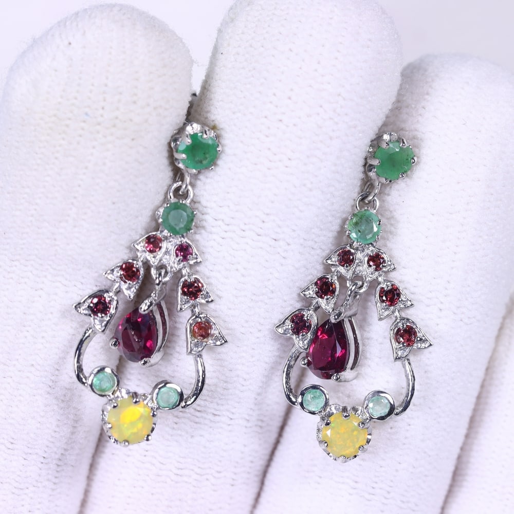 Earrings Rhodolite Emerald Opal & Tanzanite - 925 Sterling Silver, 43B: Ksmith Heritage Auctioneers Subject: Natural Rhodolite Garnet, Emerald, Fire Opal, Tanzanite Origin: Thailand Carat Weight: 3.86g Dimension: Gemstone 3x5mm Type: Earrings